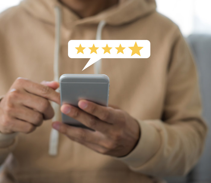 Man leaving review on phone