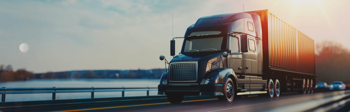 Truck with container on open road